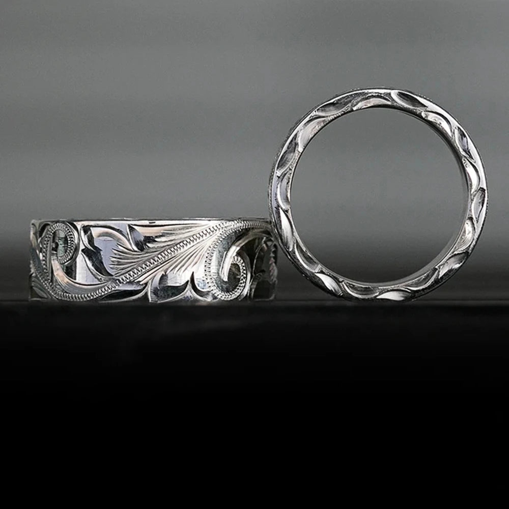 Carved couple's ring set worn on hands