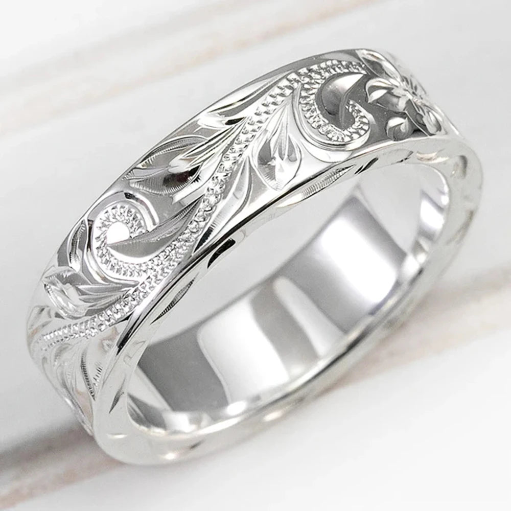 Carved couple's ring set worn on hands