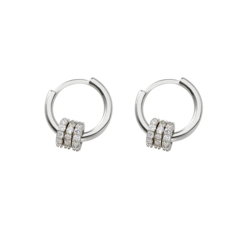 Sleek circle hoop earrings worn on ear