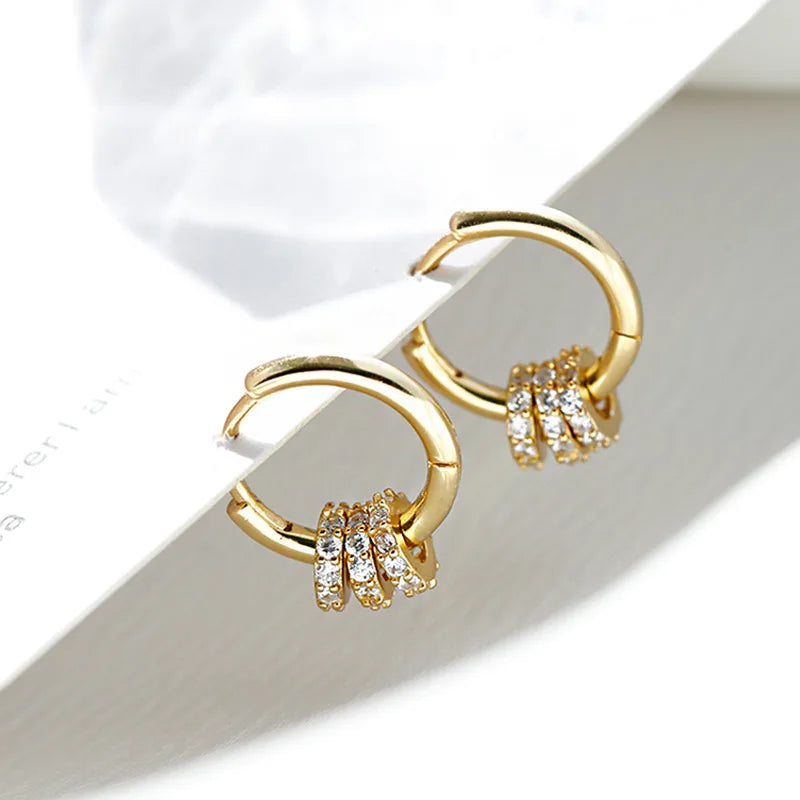 Sleek circle hoop earrings worn on ear