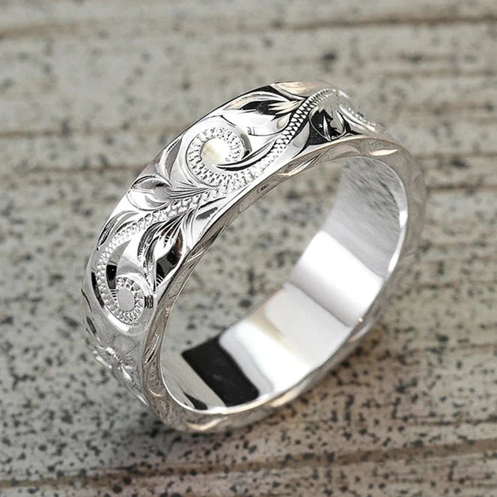 Carved couple's ring set worn on hands