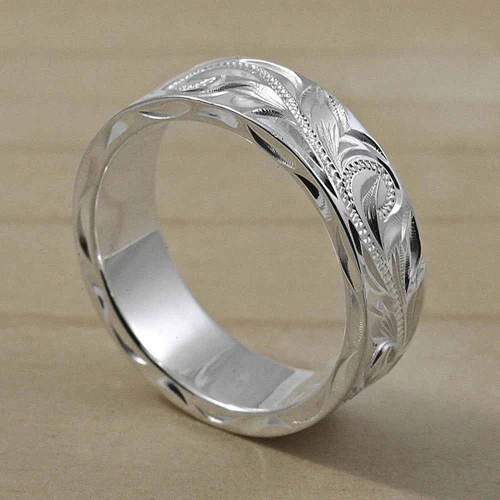 Carved couple's ring set worn on hands