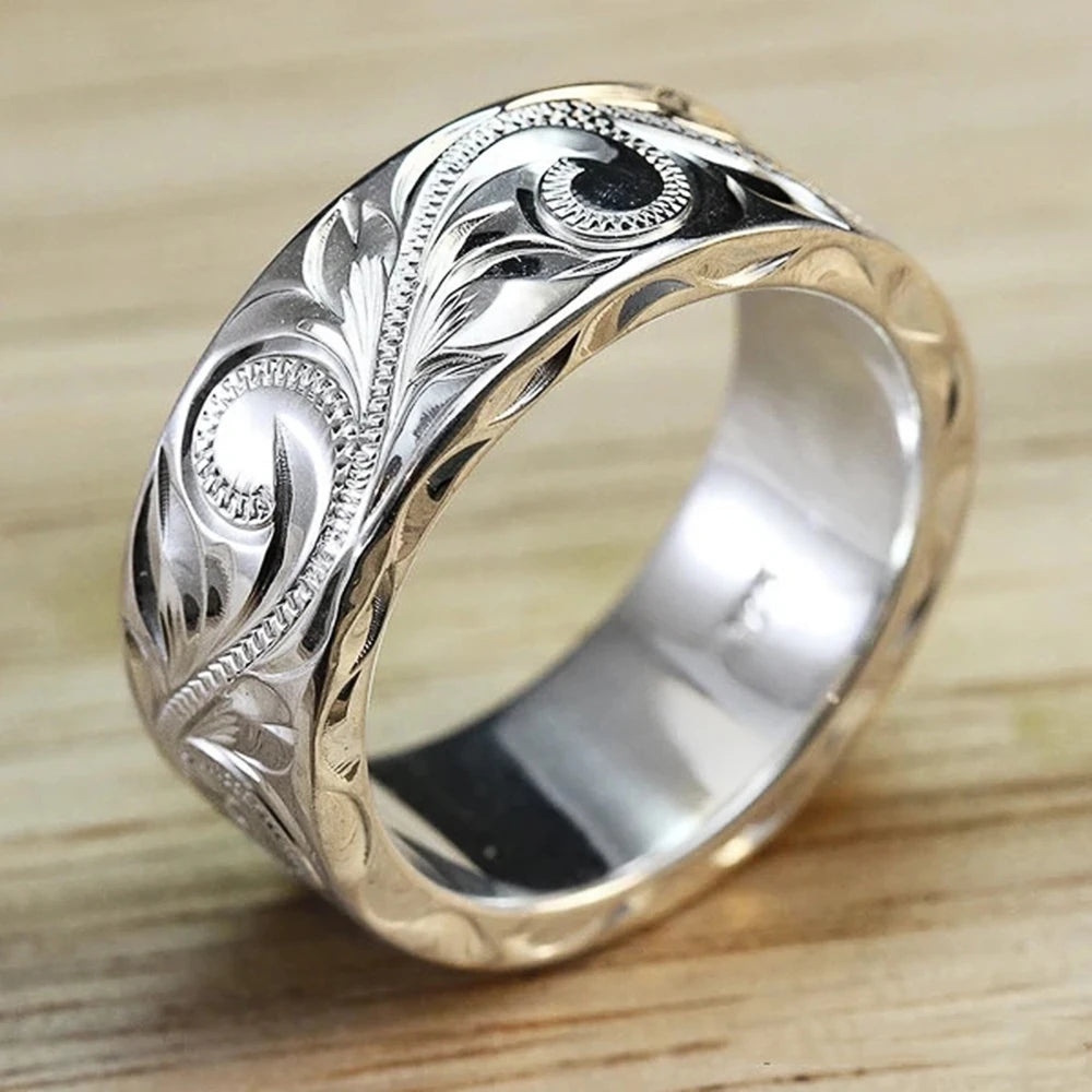 Carved couple's ring set worn on hands