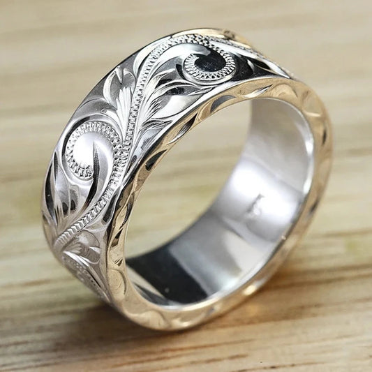 Carved couple's ring set worn on hands
