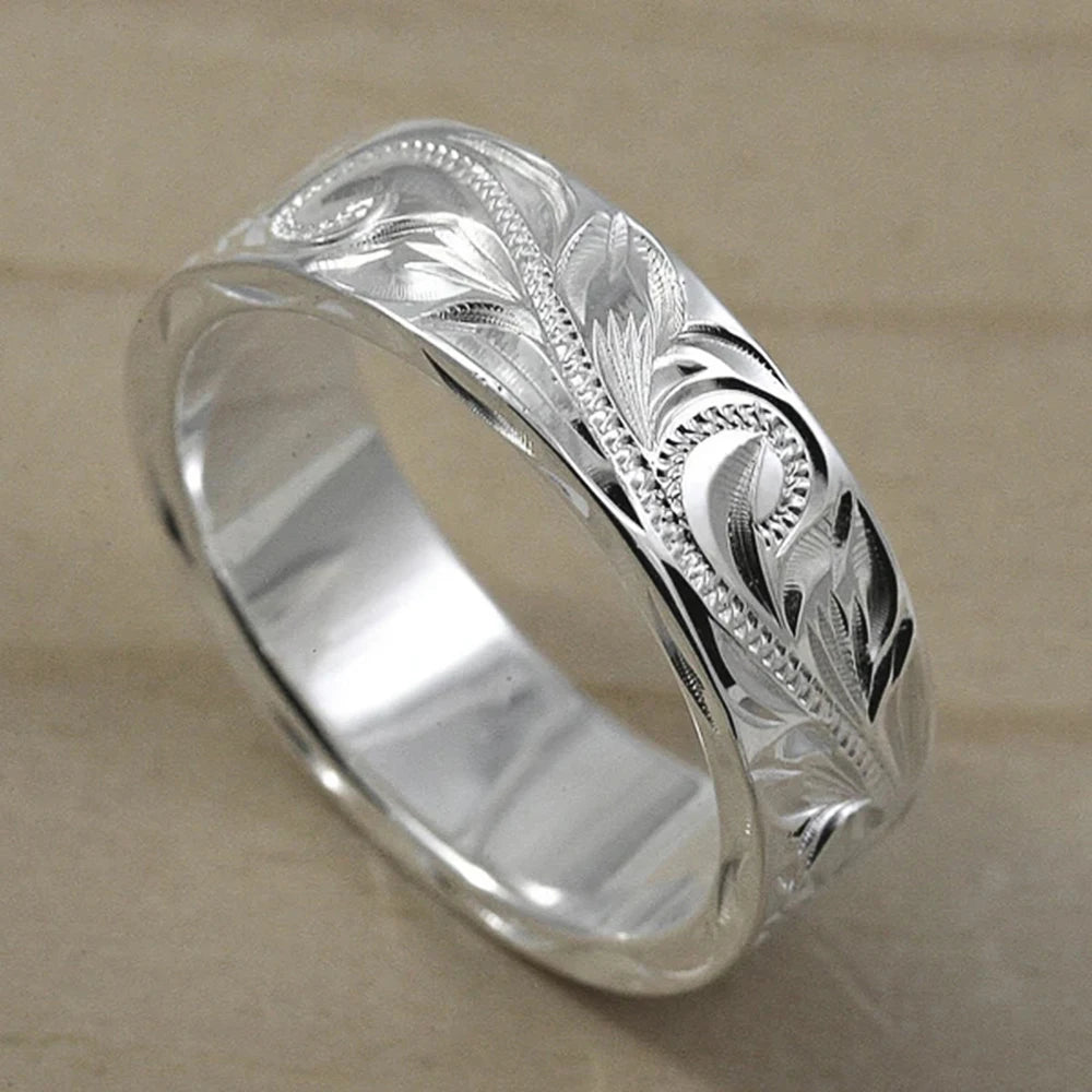 Carved couple's ring set worn on hands