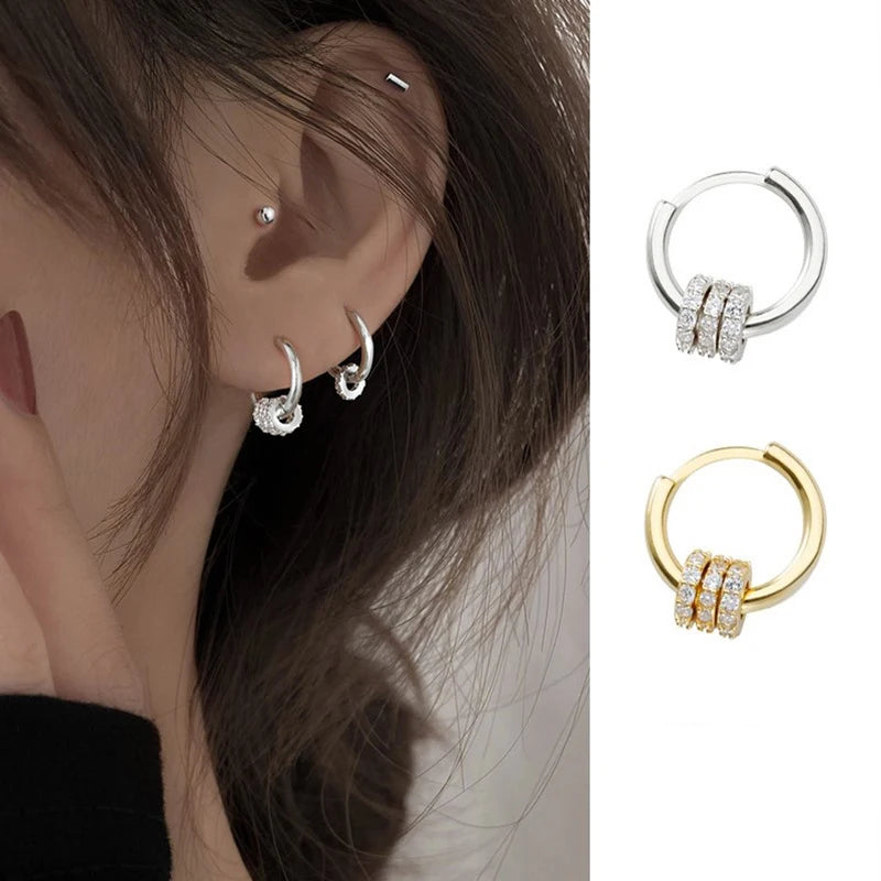 Sleek circle hoop earrings worn on ear