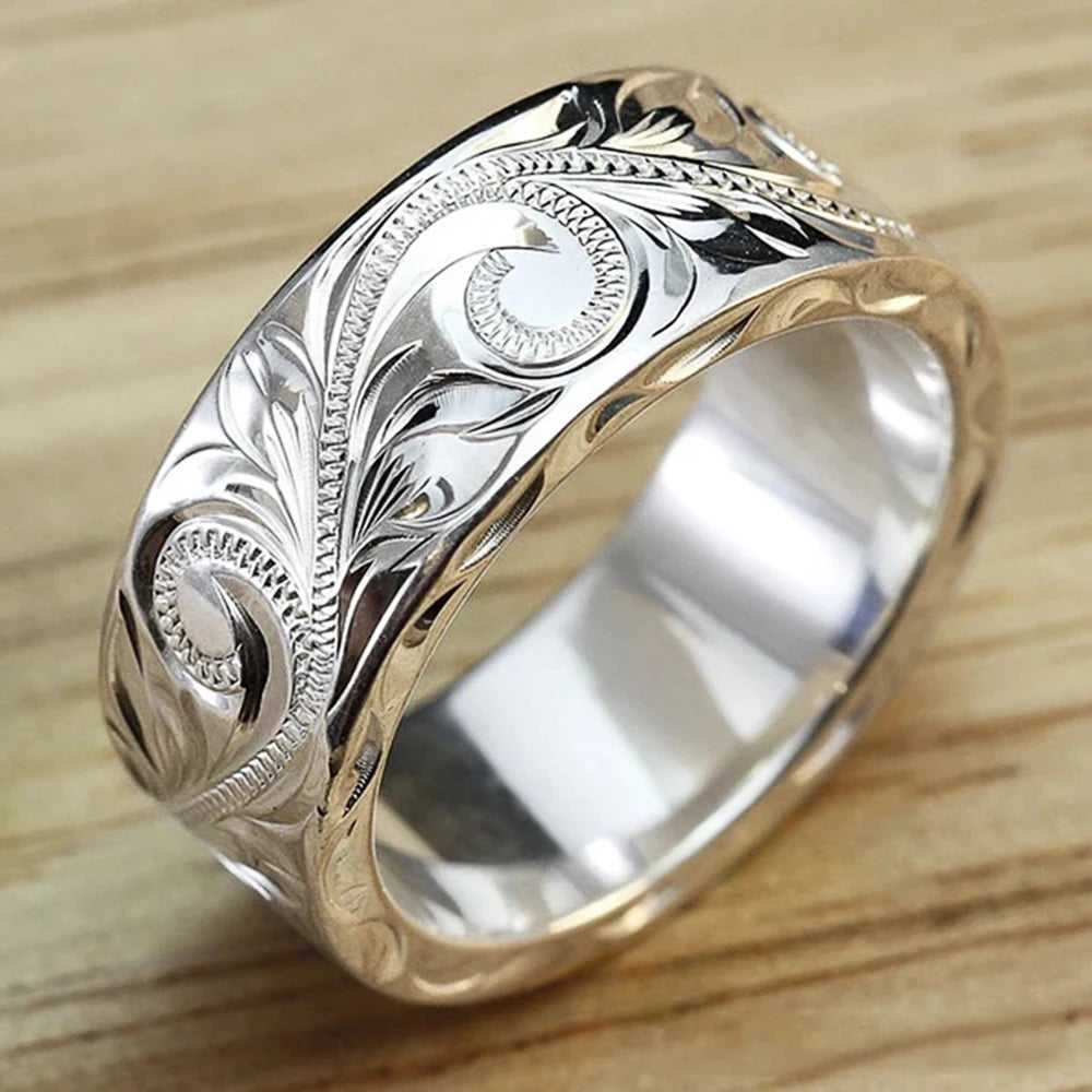 Carved couple's ring set worn on hands