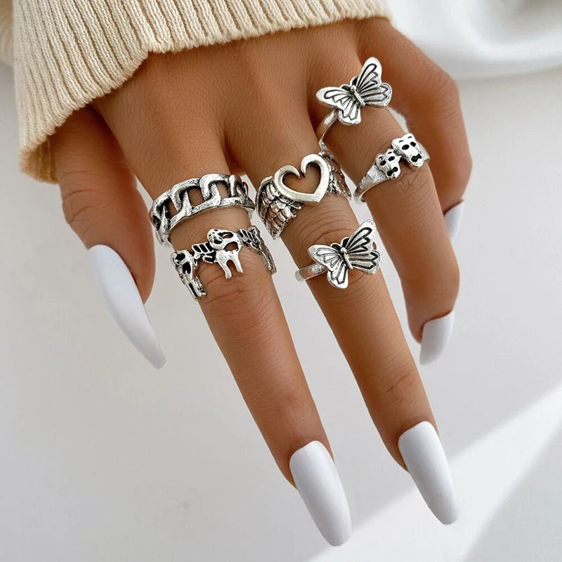 Assorted statement rings worn stacked on fingers