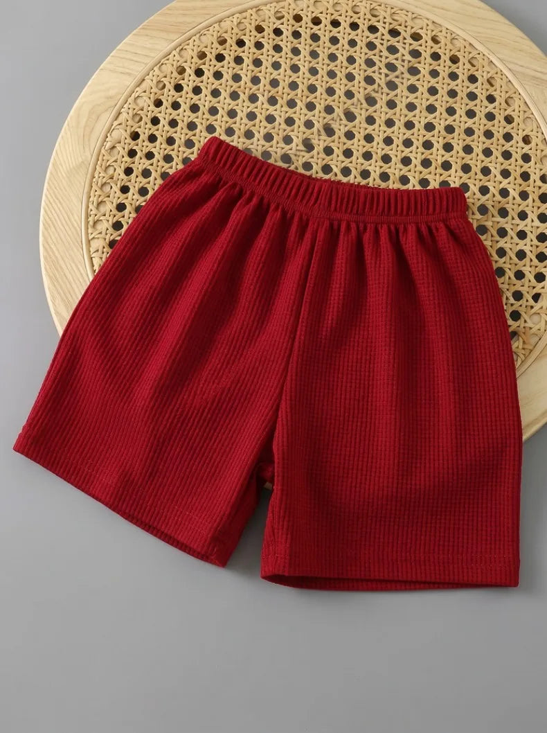 Boys vest & shorts set worn by child