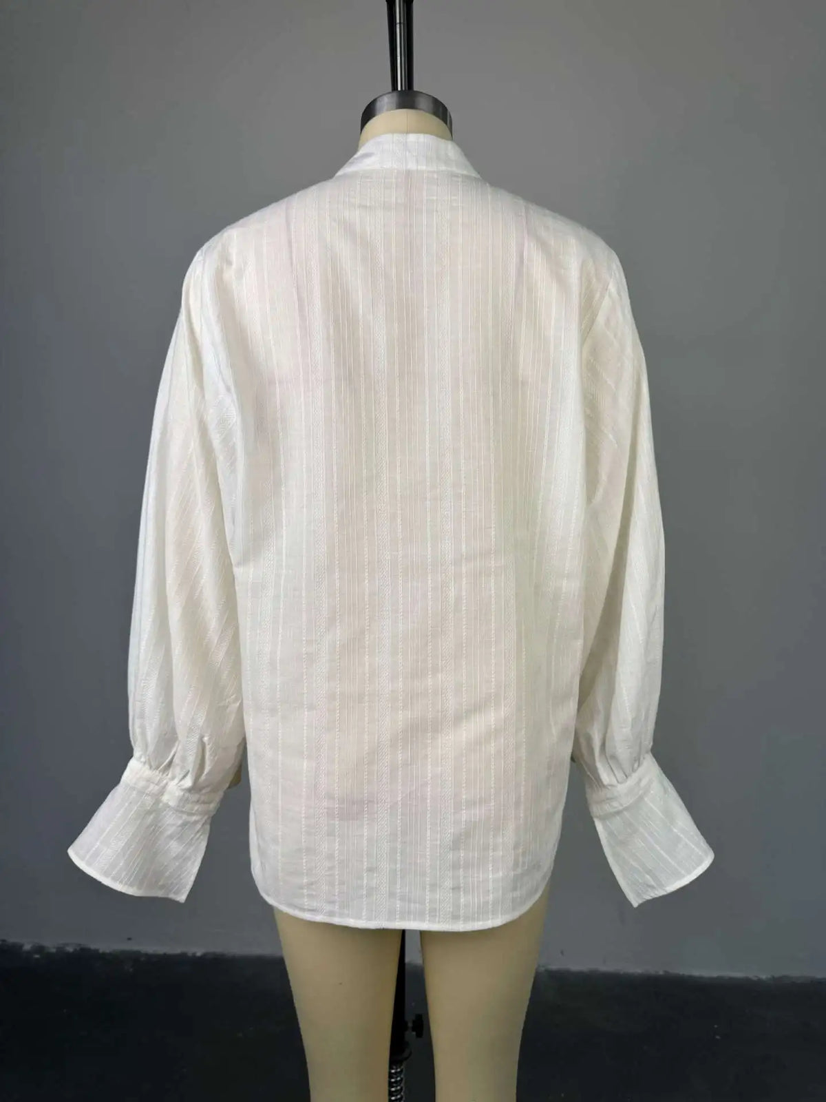 Women's oversized cotton button-up shirt worn as dress