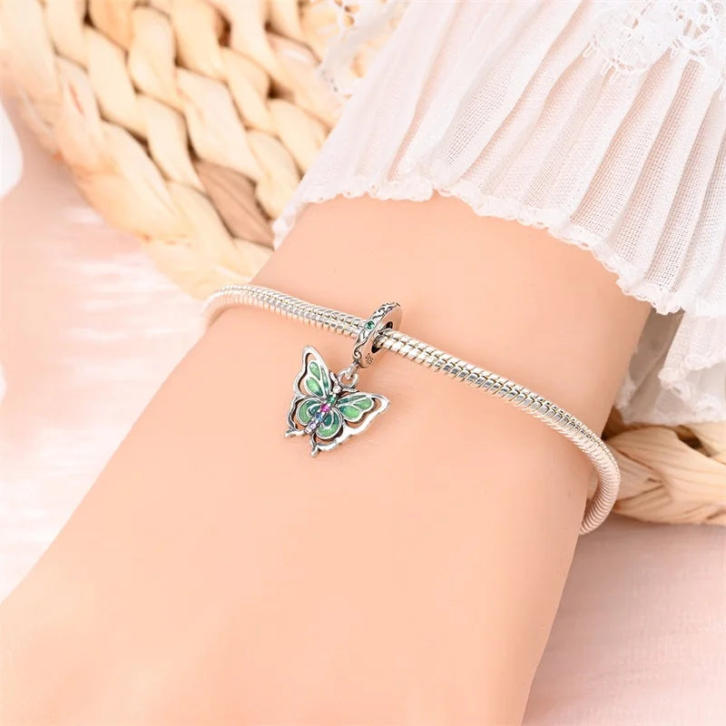 Butterfly charm beads attached to bracelet