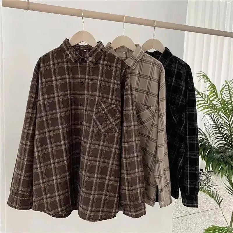  Oversized plaid shirt brown hanging close up