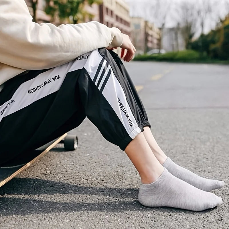 Unisex low-cut ankle socks worn on feet