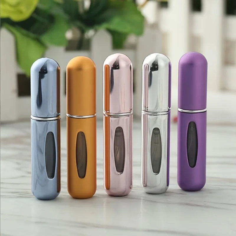 Mini Perfume Atomizer Bottles in silver, black, blue, and gold for stylish travel fragrance.