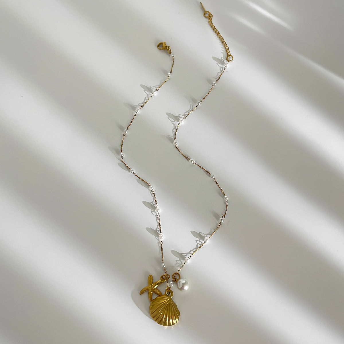 Pearl starfish shell necklace full view gold