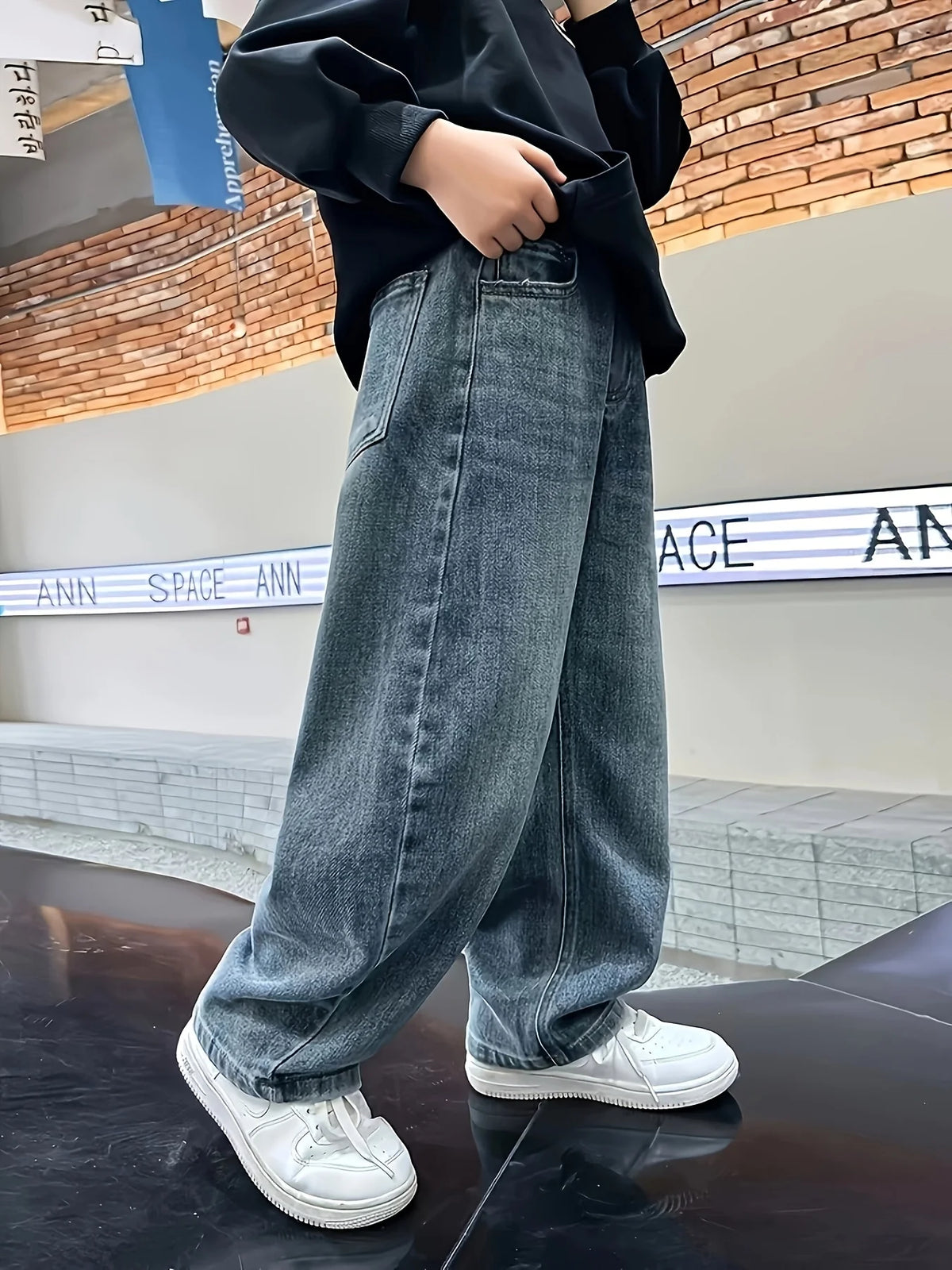 Boys loose fit jeans worn by child