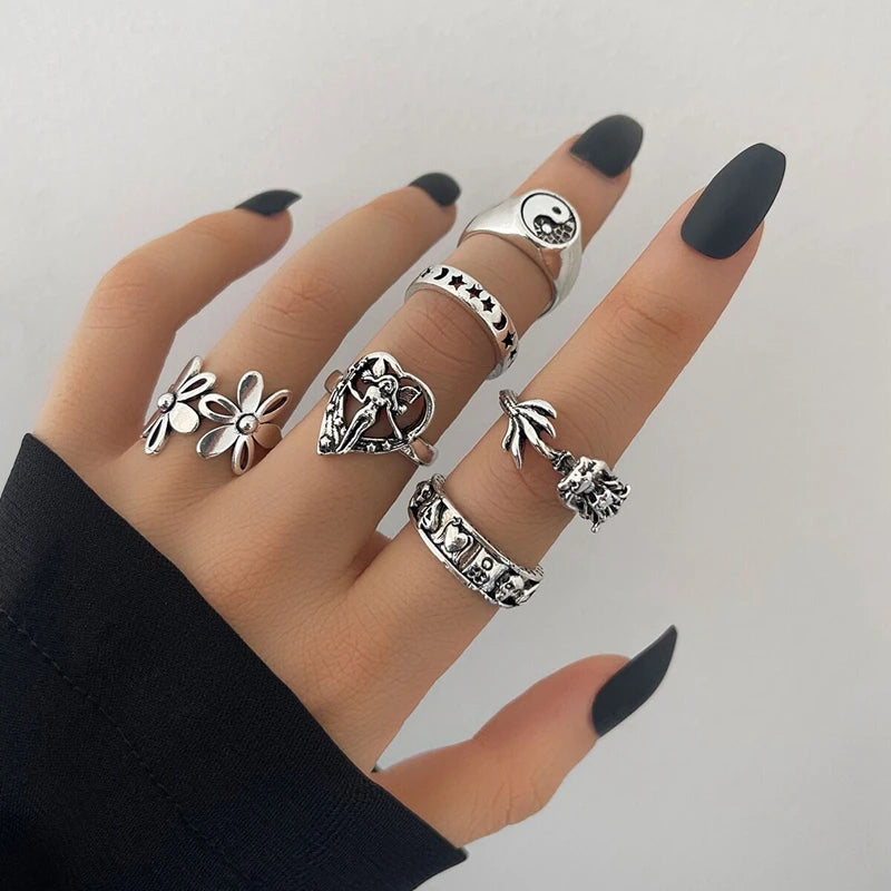 Assorted statement rings worn stacked on fingers