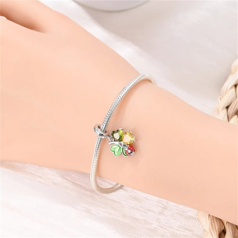 Butterfly charm beads attached to bracelet
