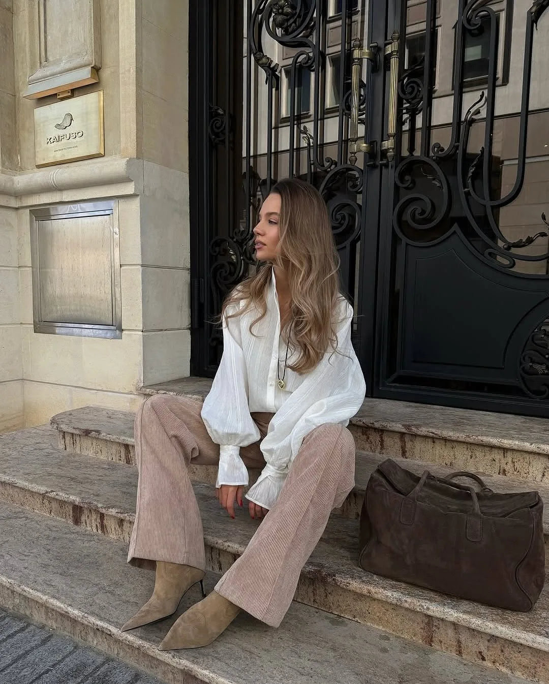 Women's oversized cotton button-up shirt worn as dress