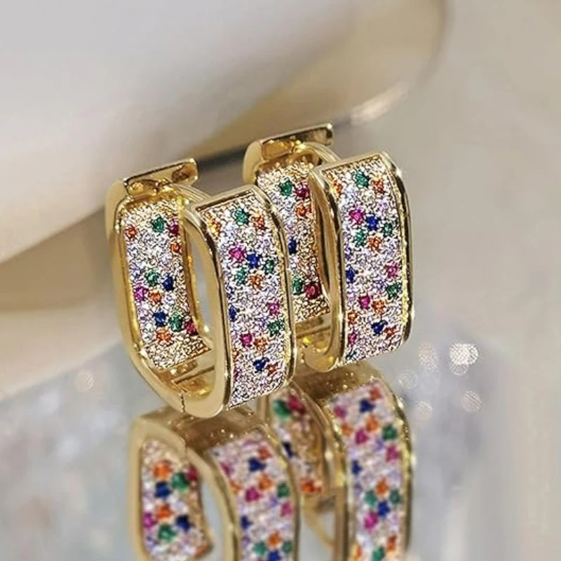 CZ paved hoop earrings worn on ear