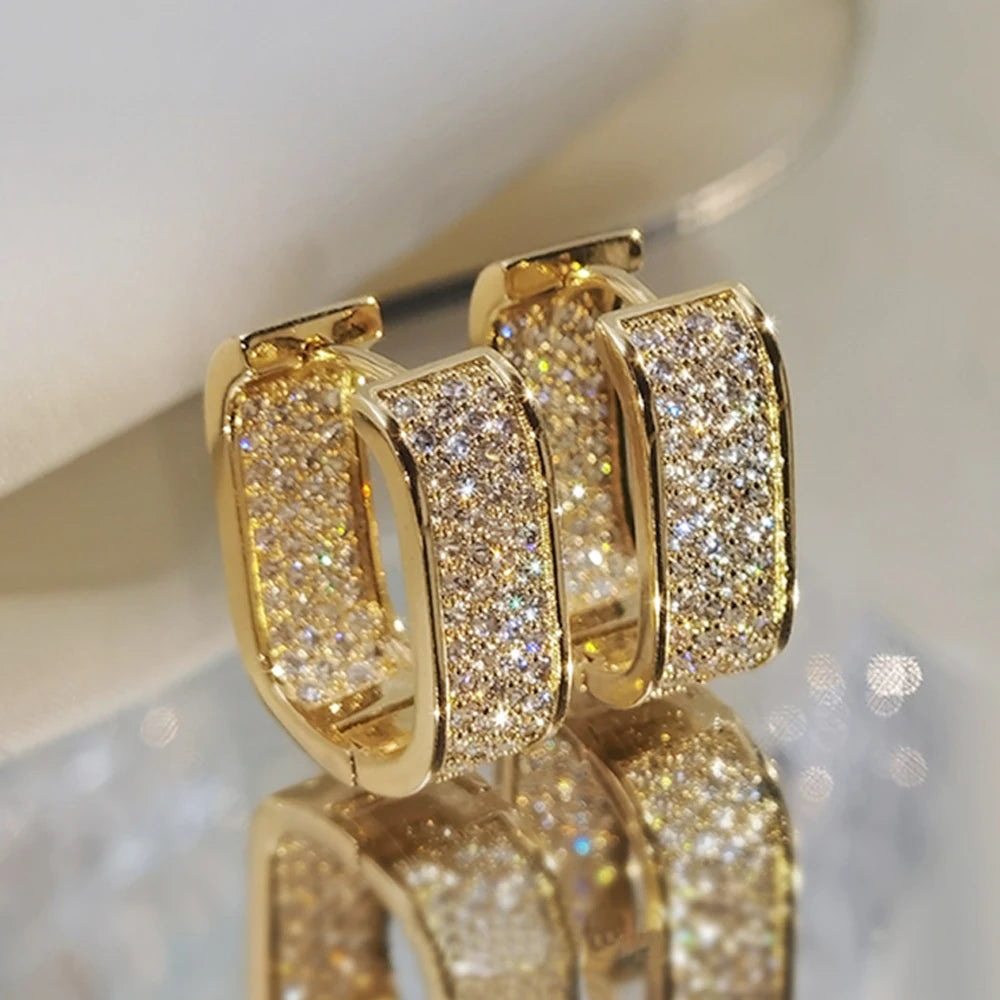 CZ paved hoop earrings worn on ear