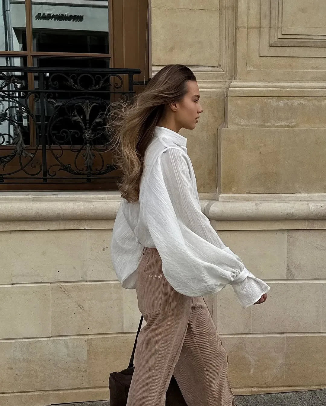 Women's oversized cotton button-up shirt worn as dress