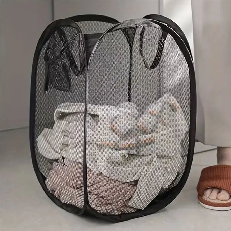 Foldable mesh laundry basket folded flat view