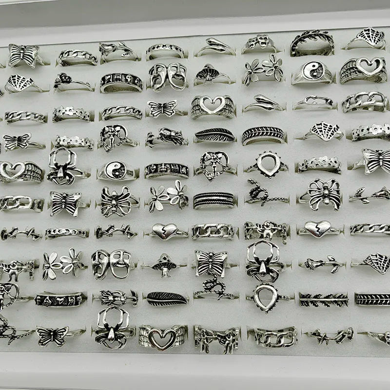 Assorted statement rings worn stacked on fingers