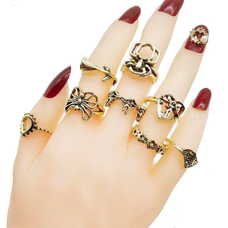 Assorted statement rings worn stacked on fingers