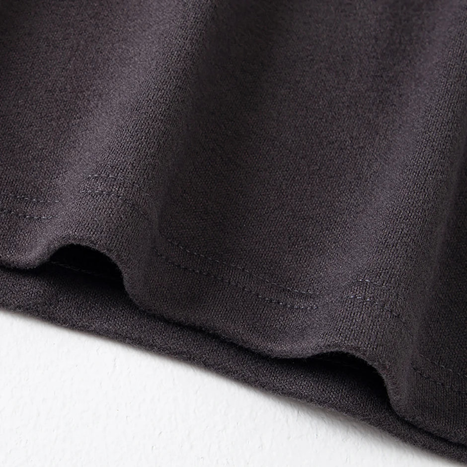 Men's semi-turtleneck long sleeve top worn under jacket