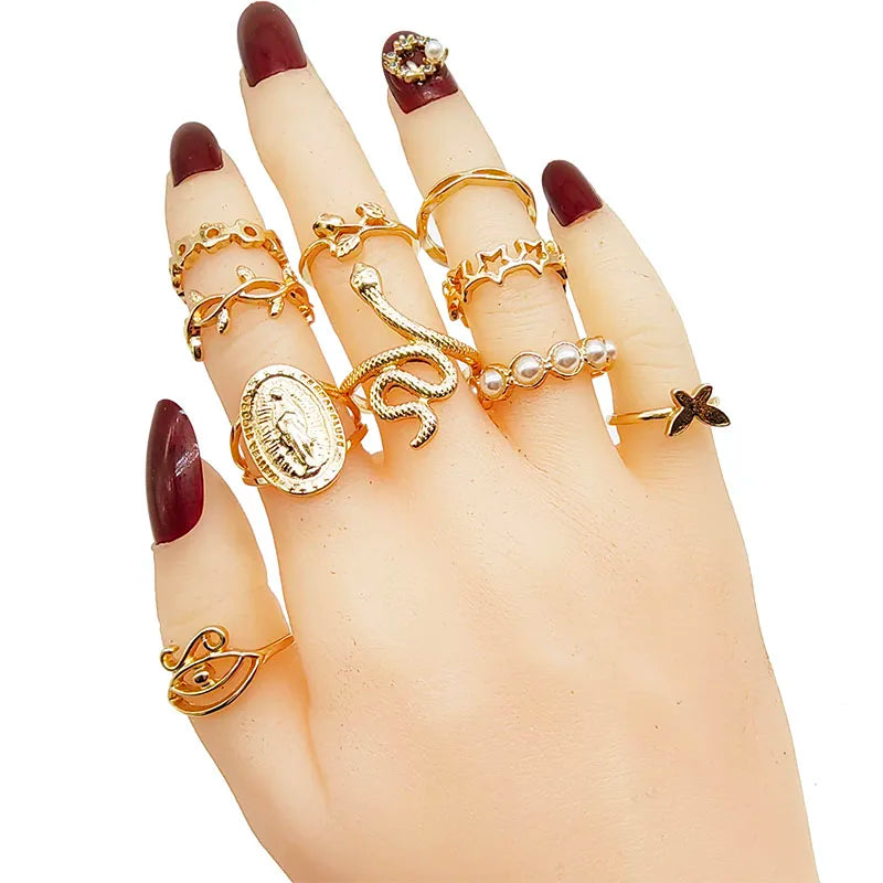 Assorted statement rings worn stacked on fingers