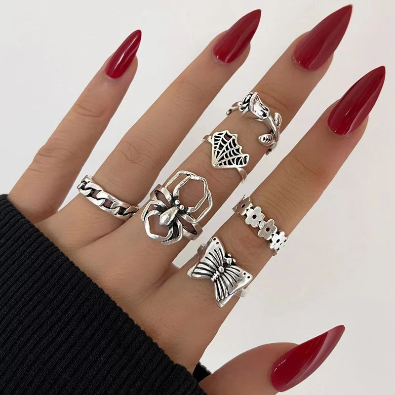 Assorted statement rings worn stacked on fingers