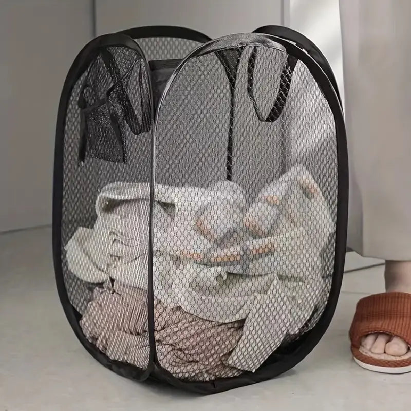 Foldable mesh laundry basket folded flat view