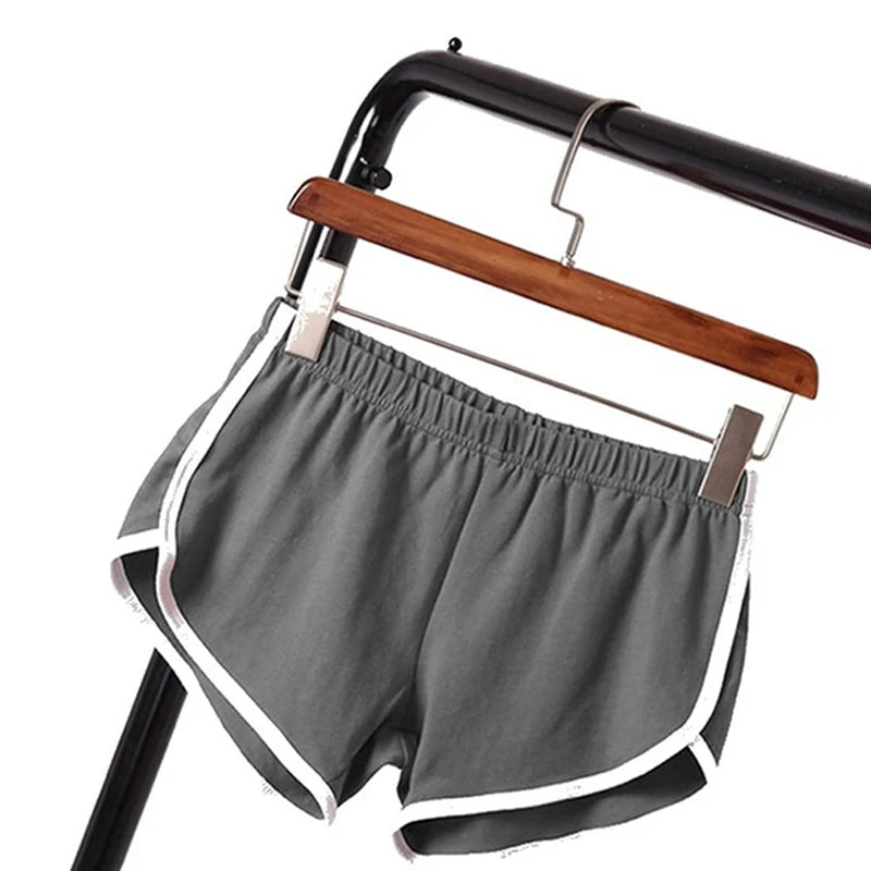 Skinny sports shorts green flat lay with hanger