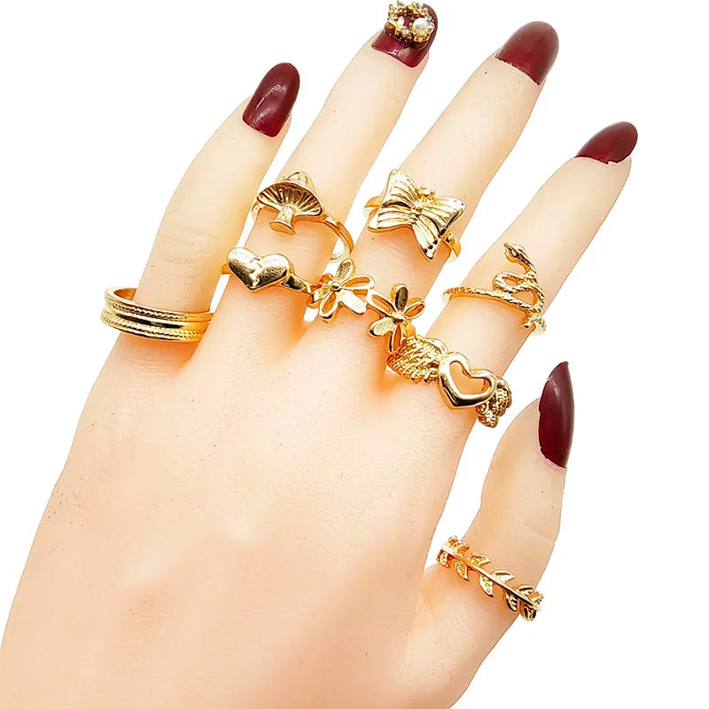 Assorted statement rings worn stacked on fingers