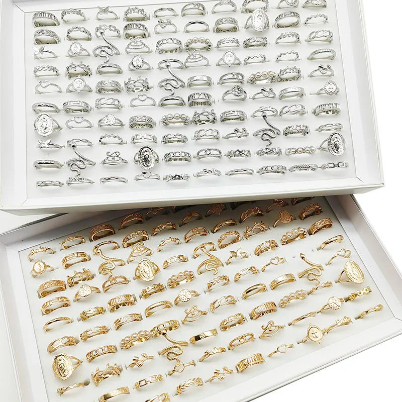 Assorted statement rings worn stacked on fingers
