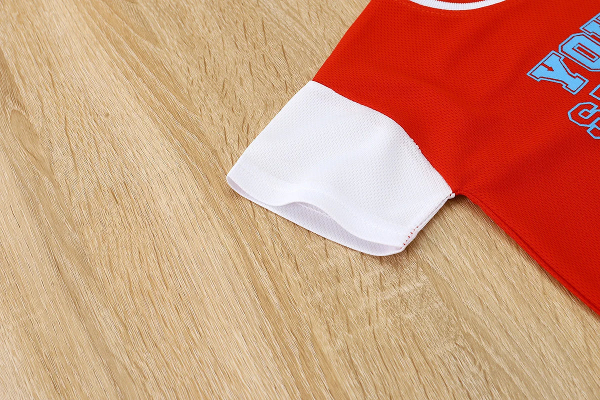Boys basketball tee & shorts set worn by child