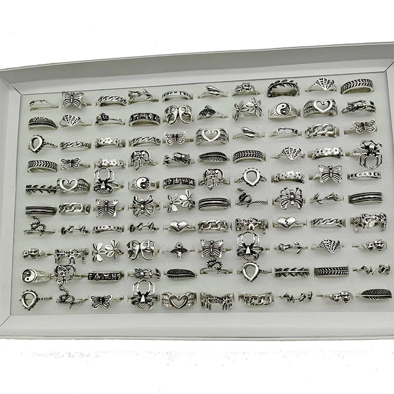 Assorted statement rings worn stacked on fingers
