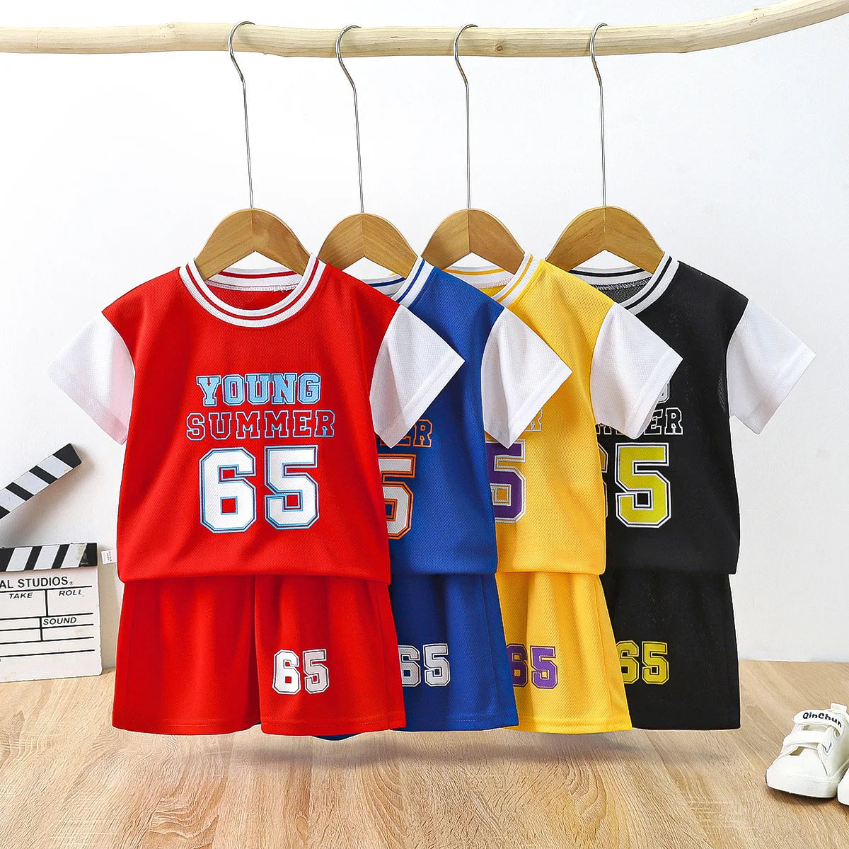 Boys basketball tee & shorts set worn by child