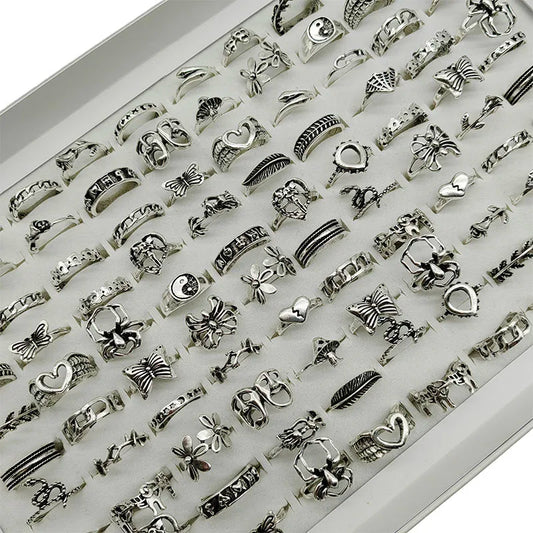 Assorted statement rings worn stacked on fingers