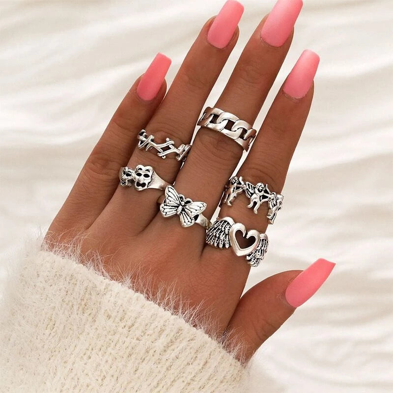 Assorted statement rings worn stacked on fingers