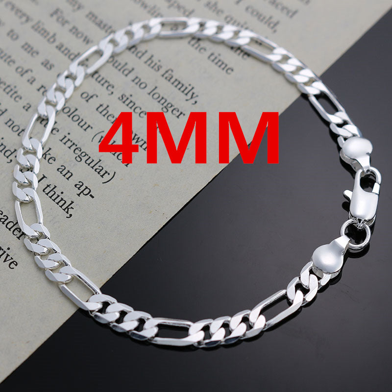Silver chain bracelet & necklace set worn on neck
