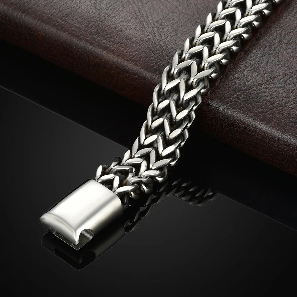 Braided stainless steel bracelet worn on wrist