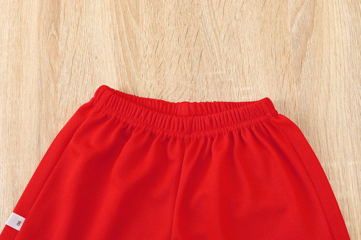 Boys basketball tee & shorts set worn by child