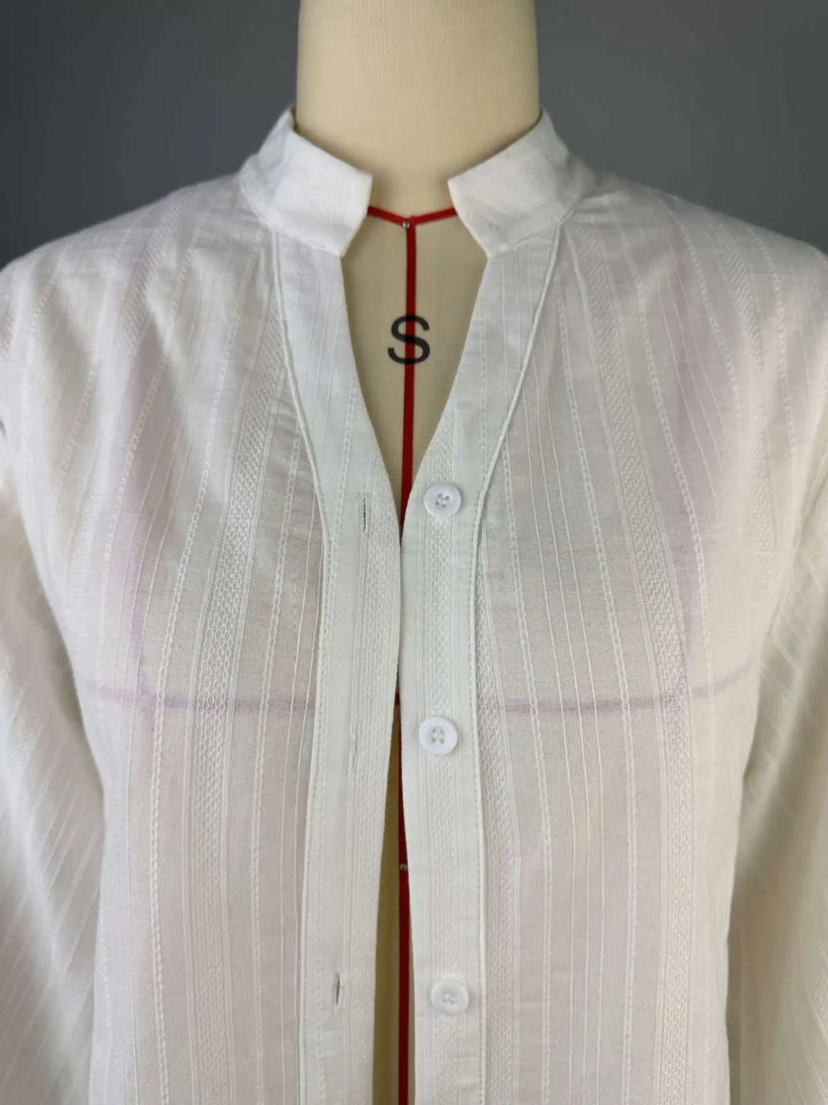 Women's oversized cotton button-up shirt worn as dress
