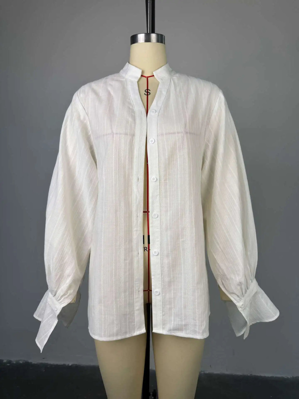 Women's oversized cotton button-up shirt worn as dress