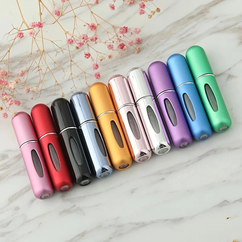 Mini Perfume Atomizer Bottles in silver, black, blue, and gold for stylish travel fragrance.