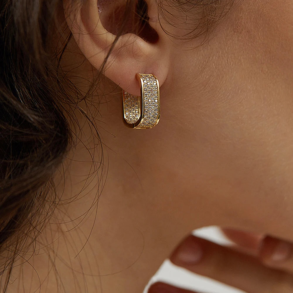 CZ paved hoop earrings worn on ear
