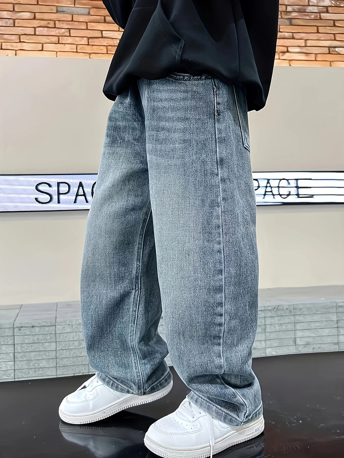 Boys loose fit jeans worn by child