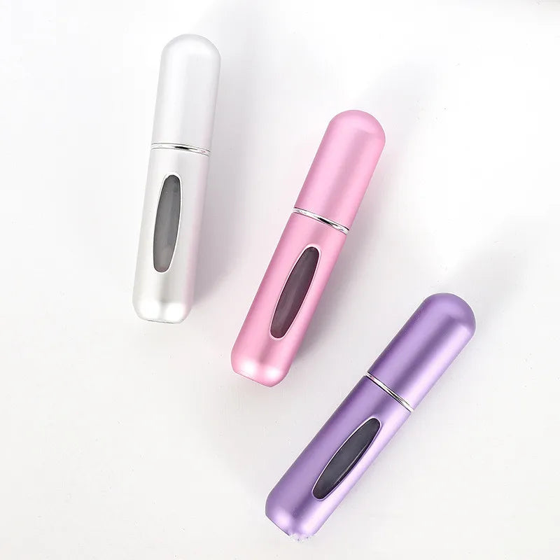 Mini travel perfume atomizer worn in use